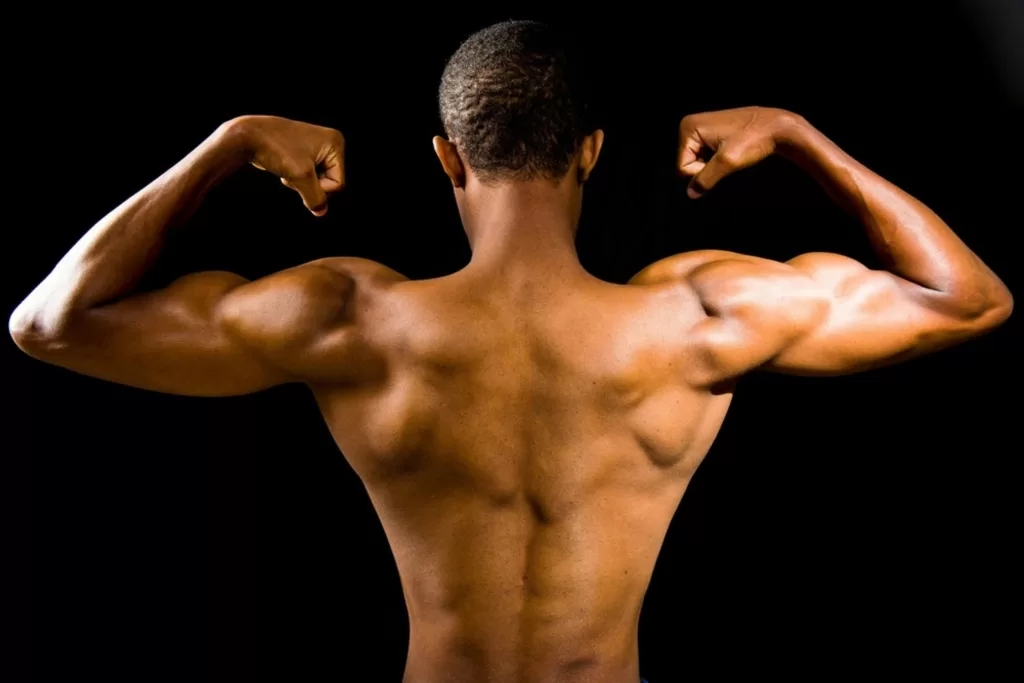 A person facing away showing their muscles - to illustrate developing resilience