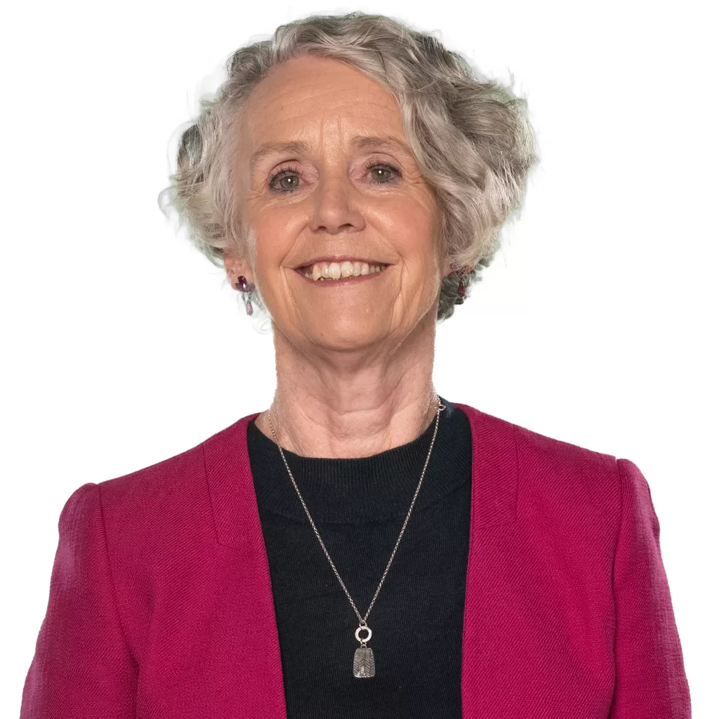 Picture of Stella Collins in a pink jacket and black top.